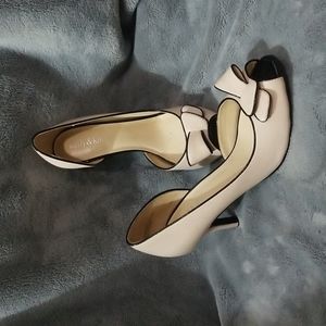 Tan and black bow heels